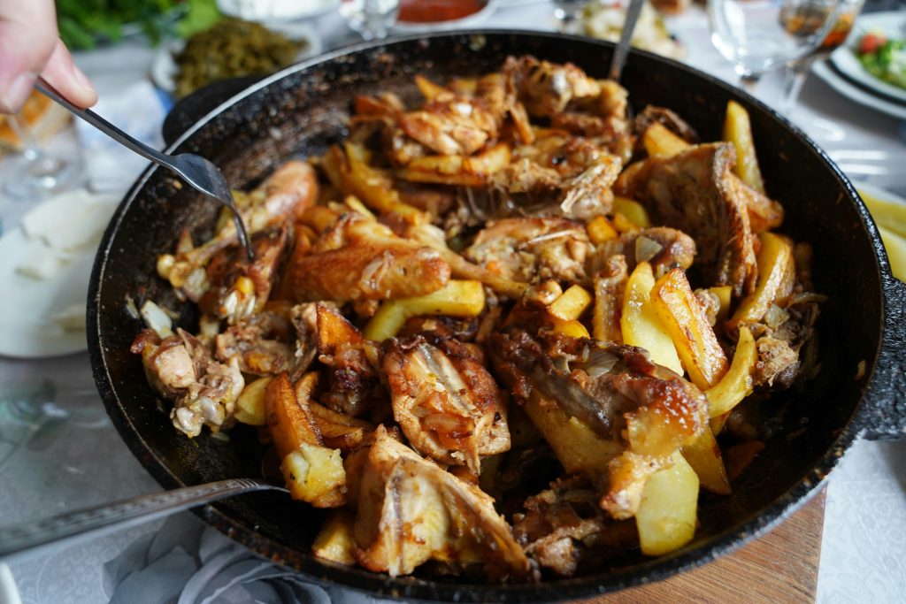 Sheet pan high-protein dinner with chicken thighs, potatoes, and vegetables